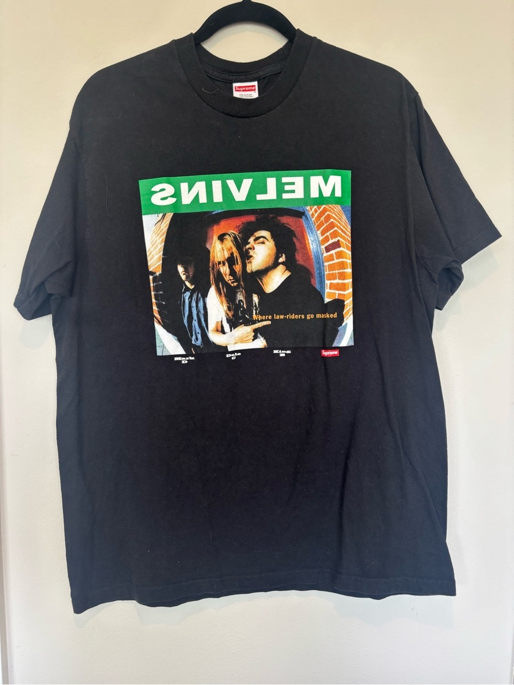 Supreme Black Tee with Green Melvins Banner and Multi-Color Graphic
